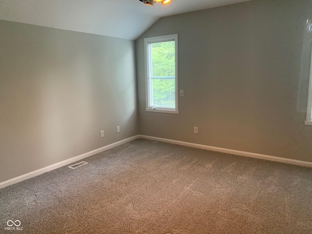 9532 Pinecreek Dr, Indianapolis, IN 46256 - carpeted empty room with lofted ceiling and baseboards