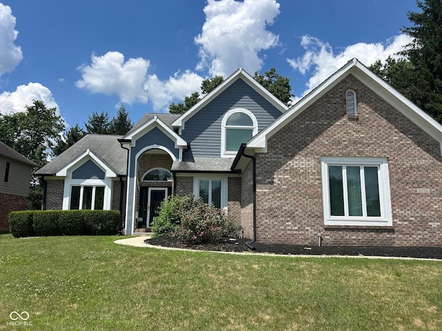 9532 Pinecreek Dr, Indianapolis, IN 46256 - view of front of home with brick siding and a front yard