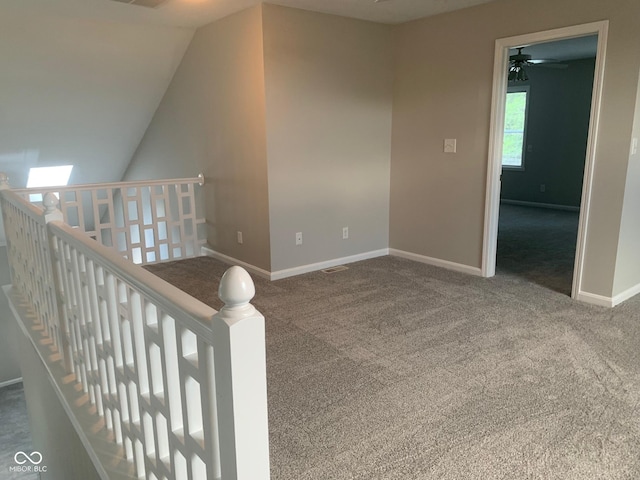 9532 Pinecreek Dr, Indianapolis, IN 46256 - hall with carpet floors and vaulted ceiling