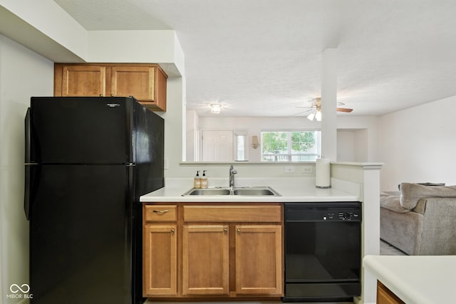 3096 Wildcat Ln, Indianapolis, IN 46203 - kitchen with black appliances, open floor plan, light countertops, a ceiling fan, and brown cabinetry
