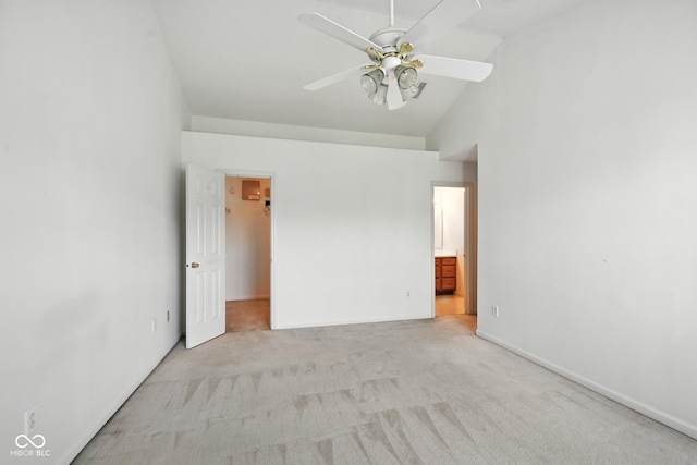 3096 Wildcat Ln, Indianapolis, IN 46203 - unfurnished bedroom with light carpet, a walk in closet, high vaulted ceiling, connected bathroom, and a ceiling fan