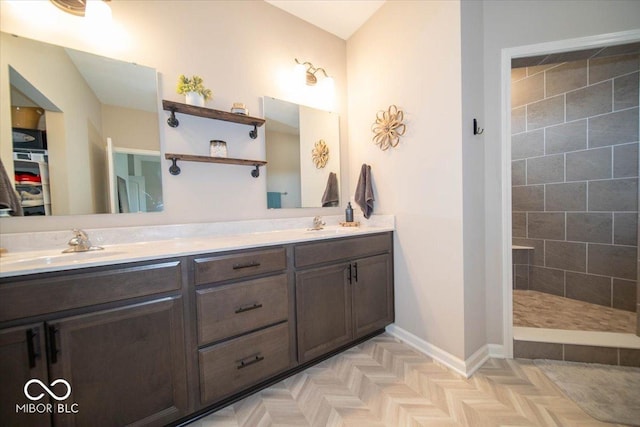 1615 N Blue Rd, Greenfield, IN 46140 - bathroom featuring double vanity, tiled shower, and a walk in closet