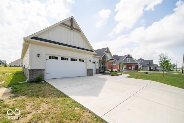 1615 N Blue Rd, Greenfield, IN 46140 - view of home's exterior with board and batten siding, a lawn, concrete driveway, a garage, and brick siding