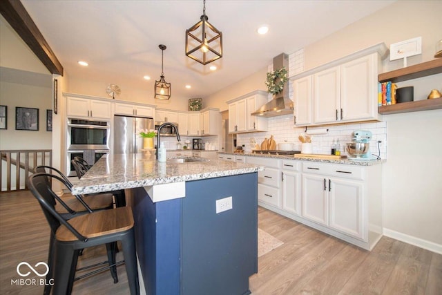 1615 N Blue Rd, Greenfield, IN 46140 - kitchen featuring stainless steel appliances, wall chimney exhaust hood, white cabinets, decorative backsplash, and recessed lighting
