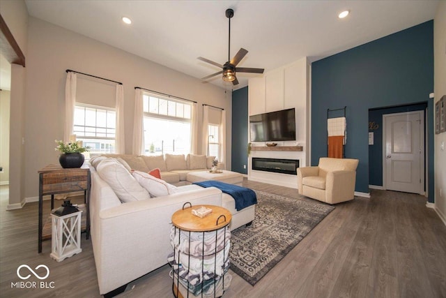 1615 N Blue Rd, Greenfield, IN 46140 - living area with a ceiling fan, wood finished floors, recessed lighting, and a glass covered fireplace
