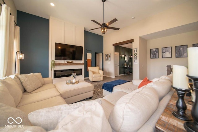 1615 N Blue Rd, Greenfield, IN 46140 - living area featuring ceiling fan, wood finished floors, a glass covered fireplace, and recessed lighting