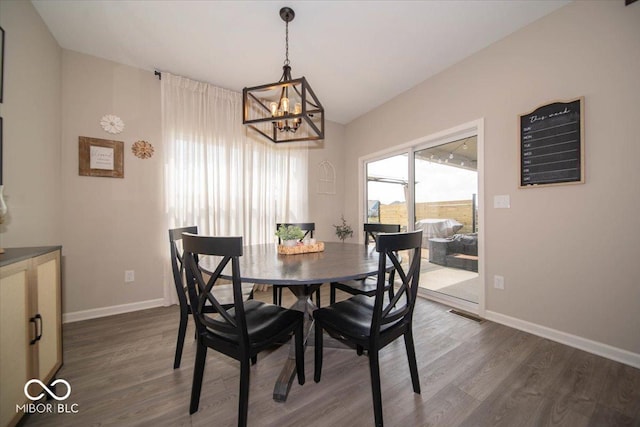 1615 N Blue Rd, Greenfield, IN 46140 - dining room featuring a chandelier, dark wood finished floors, and vaulted ceiling