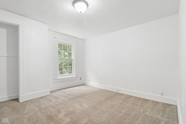 525 N Concord St N, Indianapolis, IN 46222 - carpeted spare room featuring baseboards