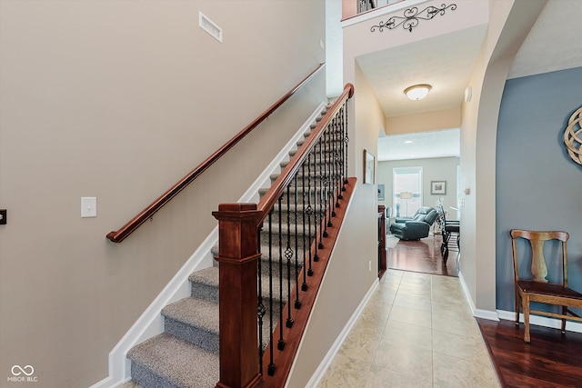 823 Colin Dr, Avon, IN 46123 - stairs featuring baseboards and arched walkways