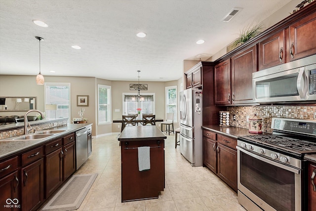 823 Colin Dr, Avon, IN 46123 - kitchen with appliances with stainless steel finishes, dark countertops, plenty of natural light, recessed lighting, and a textured ceiling
