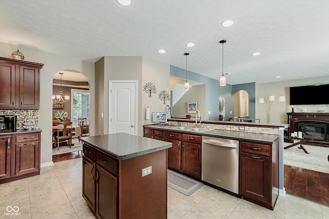 823 Colin Dr, Avon, IN 46123 - kitchen with dishwasher, arched walkways, a center island, dark countertops, and recessed lighting