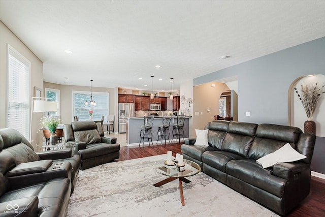 823 Colin Dr, Avon, IN 46123 - living area featuring dark wood finished floors, recessed lighting, and arched walkways
