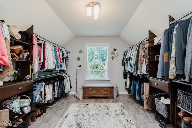 823 Colin Dr, Avon, IN 46123 - walk in closet with lofted ceiling and wood finished floors