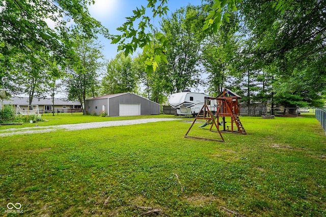 6020 E Smokey View Rd, Mooresville, IN 46158 - view of yard with a garage, a playground, and an outbuilding