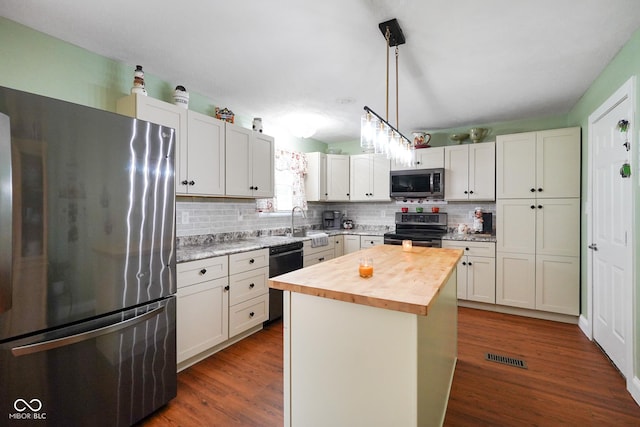 6020 E Smokey View Rd, Mooresville, IN 46158 - kitchen with appliances with stainless steel finishes, wooden counters, backsplash, and dark wood-style flooring