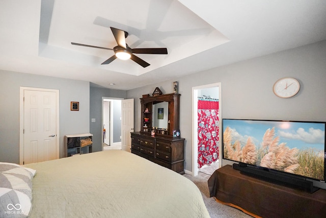 6020 E Smokey View Rd, Mooresville, IN 46158 - bedroom featuring a tray ceiling, carpet floors, and a ceiling fan