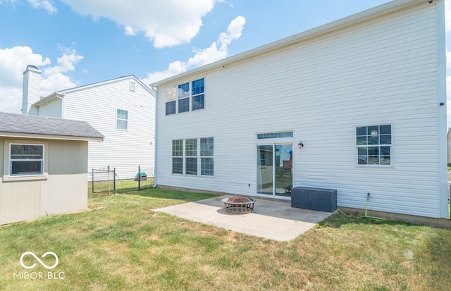 10450 Wintergreen Way, Indianapolis, IN 46234 - back of property with a patio and an outdoor fire pit