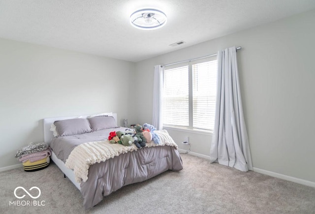 10450 Wintergreen Way, Indianapolis, IN 46234 - bedroom with light colored carpet and a textured ceiling
