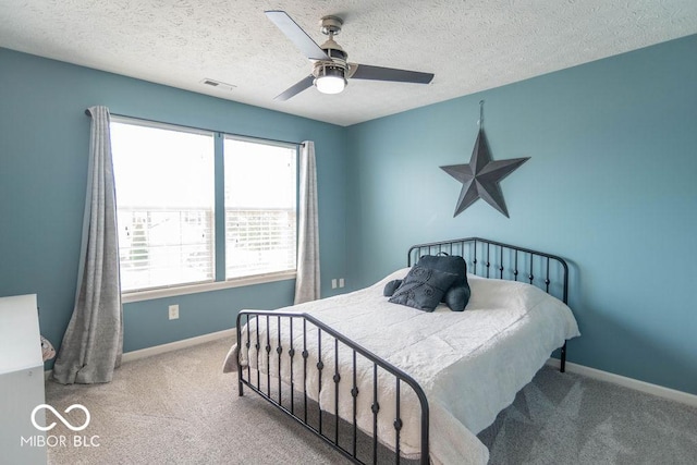 10450 Wintergreen Way, Indianapolis, IN 46234 - bedroom with carpet floors, a ceiling fan, and a textured ceiling