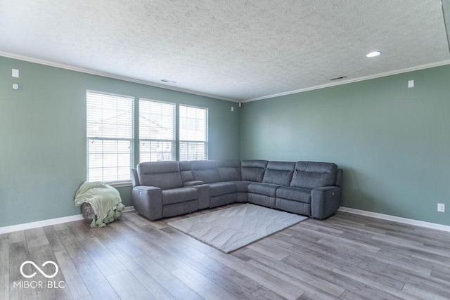 10450 Wintergreen Way, Indianapolis, IN 46234 - living room with wood finished floors, ornamental molding, a textured ceiling, and recessed lighting