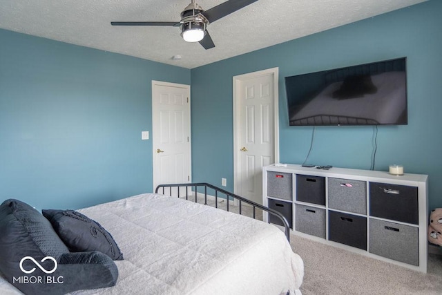 10450 Wintergreen Way, Indianapolis, IN 46234 - carpeted bedroom with a textured ceiling and ceiling fan