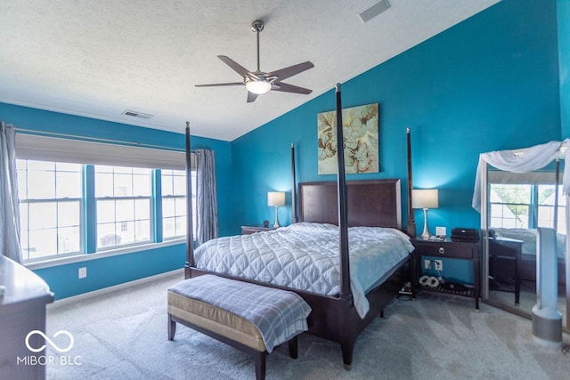 10450 Wintergreen Way, Indianapolis, IN 46234 - bedroom featuring carpet floors, vaulted ceiling, a textured ceiling, and a ceiling fan