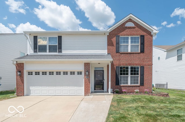 10450 Wintergreen Way, Indianapolis, IN 46234 - traditional-style house featuring driveway, brick siding, and a front lawn