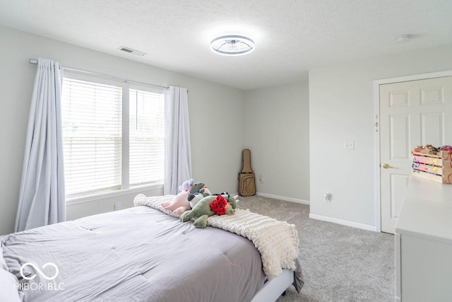 10450 Wintergreen Way, Indianapolis, IN 46234 - bedroom featuring carpet flooring and a textured ceiling