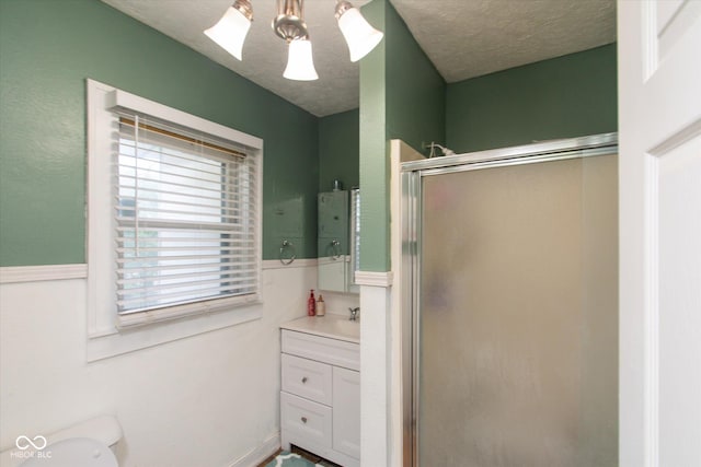 3459 W Michigan St, Indianapolis, IN 46222 - bathroom featuring a shower stall, vanity, and a textured ceiling