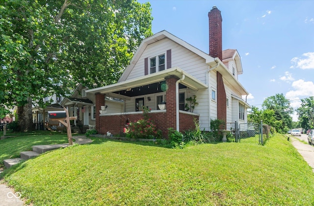 3459 W Michigan St, Indianapolis, IN 46222 - view of side of home featuring a porch, a chimney, and brick siding