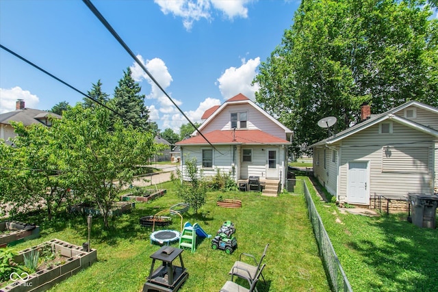3459 W Michigan St, Indianapolis, IN 46222 - back of house with a vegetable garden