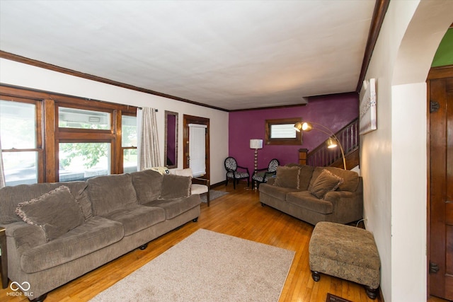 3459 W Michigan St, Indianapolis, IN 46222 - living area featuring stairway, arched walkways, wood finished floors, and crown molding