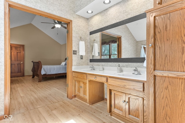 7621 Forest Dr, Fishers, IN 46038 - full bathroom featuring lofted ceiling, a ceiling fan, double vanity, wood finished floors, and ensuite bathroom