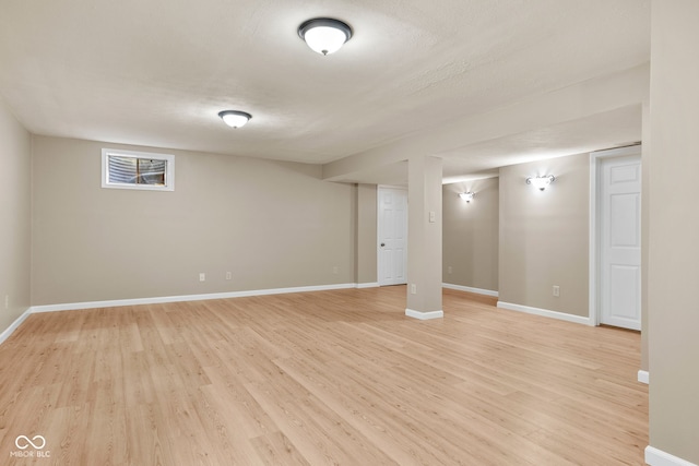 7621 Forest Dr, Fishers, IN 46038 - below grade area featuring light wood-type flooring and baseboards