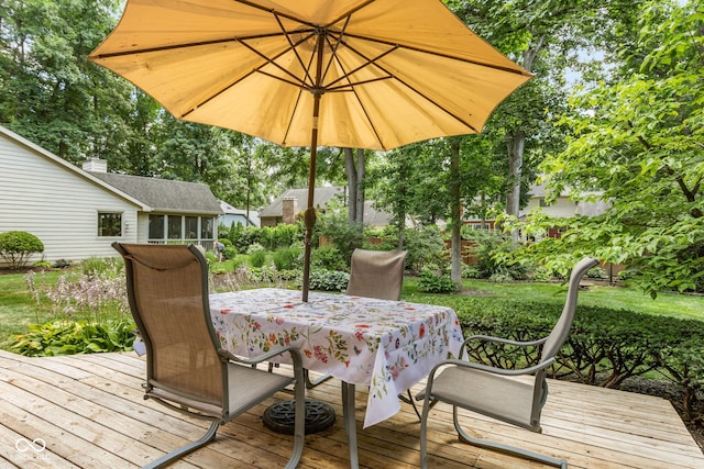 7621 Forest Dr, Fishers, IN 46038 - wooden terrace featuring a sunroom, outdoor dining area, and view of scattered trees