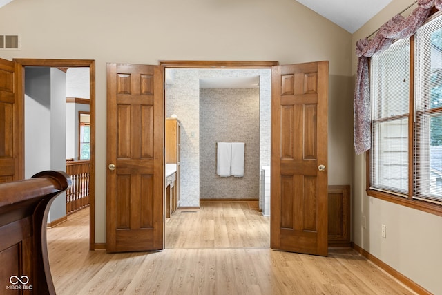 7621 Forest Dr, Fishers, IN 46038 - hallway featuring light wood finished floors and lofted ceiling