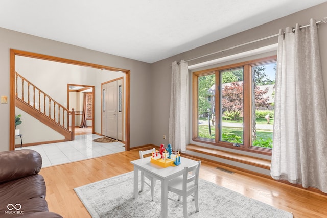 7621 Forest Dr, Fishers, IN 46038 - living area with light wood-type flooring and stairs