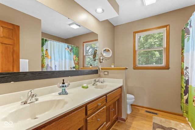 7621 Forest Dr, Fishers, IN 46038 - bathroom with wood finished floors, double vanity, and a shower with curtain