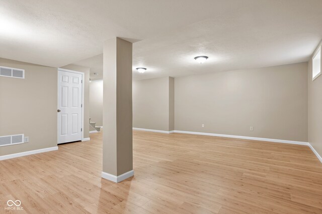 7621 Forest Dr, Fishers, IN 46038 - finished basement featuring light wood finished floors and stairway