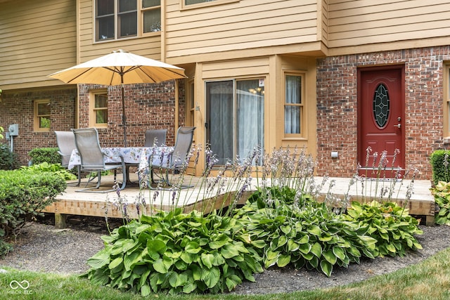 7621 Forest Dr, Fishers, IN 46038 - view of exterior entry with brick siding and a deck