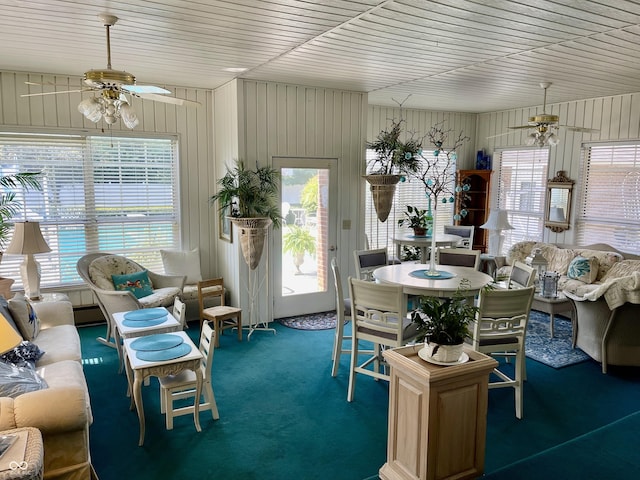 800 Walton Dr, Plainfield, IN 46168 - living area with ceiling fan, healthy amount of natural light, carpet flooring, and wooden walls
