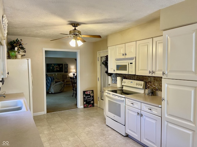 800 Walton Dr, Plainfield, IN 46168 - kitchen featuring white appliances, ceiling fan, light countertops, white cabinetry, and a textured ceiling