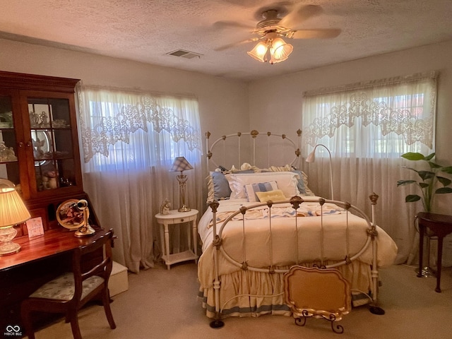 800 Walton Dr, Plainfield, IN 46168 - bedroom featuring light colored carpet, a textured ceiling, and a ceiling fan