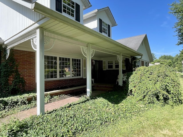 800 Walton Dr, Plainfield, IN 46168 - view of side of home featuring covered porch and brick siding