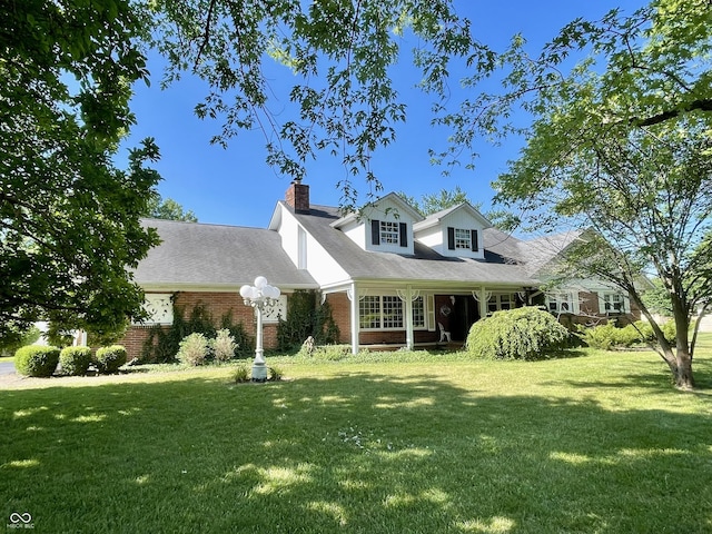 800 Walton Dr, Plainfield, IN 46168 - cape cod house with a front yard, brick siding, and a chimney