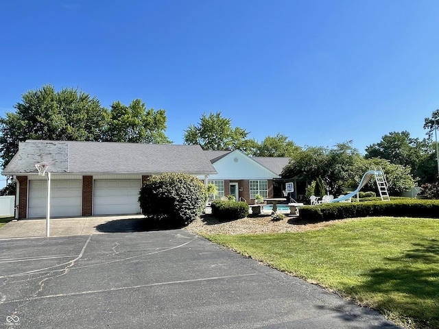 800 Walton Dr, Plainfield, IN 46168 - single story home with brick siding, an attached garage, asphalt driveway, and a front lawn