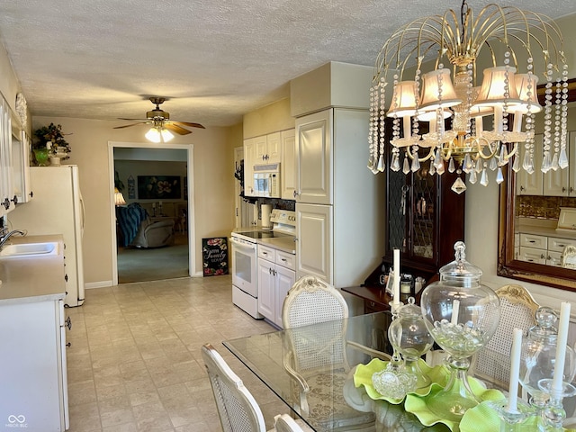 800 Walton Dr, Plainfield, IN 46168 - dining room featuring a ceiling fan, a chandelier, a textured ceiling, and light floors