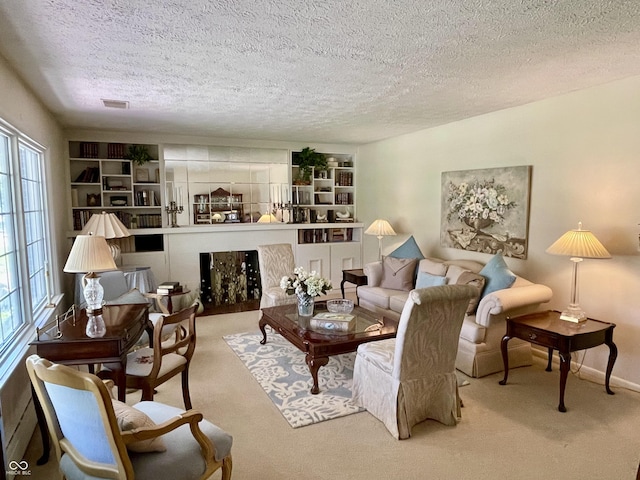800 Walton Dr, Plainfield, IN 46168 - living room featuring carpet floors, a textured ceiling, and built in shelves