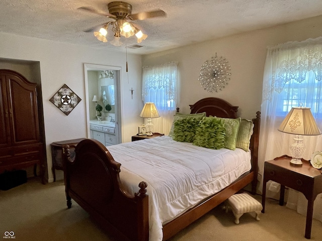 800 Walton Dr, Plainfield, IN 46168 - bedroom featuring light colored carpet, ensuite bathroom, a ceiling fan, and a textured ceiling