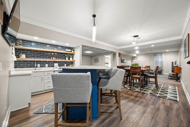 115 Jordan Rd, Indianapolis, IN 46217 - dining room with wet bar, dark wood-style flooring, crown molding, and recessed lighting